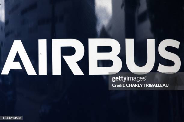 Photograph shows an information sign depicting the logo of Airbus at the entrance of a building of the Airbus Defence and Space headquarters in...