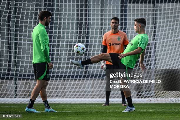 Sporting Lisbon's Portuguese forward Paulinho Dias Fernandes and Sporting Lisbon's Portuguese midfielder Pedro Goncalves take part in a training...