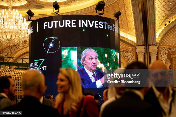 Screen broadcasts Ray Dalio, billionaire and founder of Bridgewater Associates LP, as he speaks during a panel session at the Future Investment...