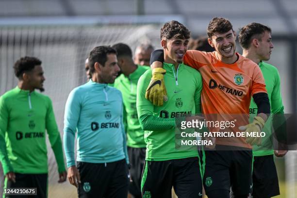 Sporting Lisbon's Uruguayan goalkeeper Franco Israel and Sporting Lisbon's Spanish defender Jose Martinez Marsa arrive for a training session at the...