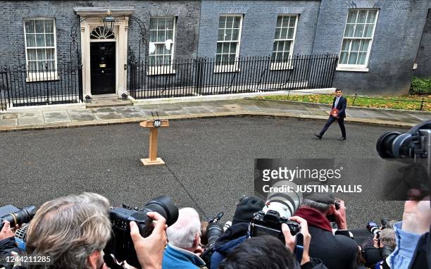 Britain's newly appointed Prime Minister Rishi Sunak arrives at the podium to deliver a speech outside 10 Downing Street in central London, on...