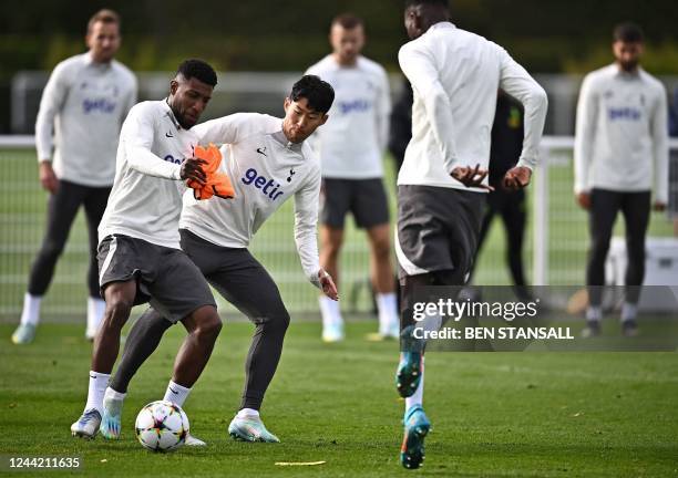 Tottenham Hotspur's Brazilian defender Emerson Royal and Tottenham Hotspur's South Korean striker Son Heung-Min take part in a team training session...