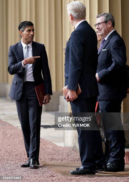 New Conservative Party leader and Britain's Prime Minister Rishi Sunak gestures as he leaves from Buckingham Palace in London on October 25 following...