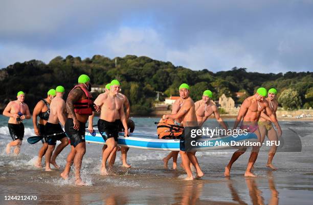 Marcus Smith of England takes part in a England Training session alongside Jack Willis and Henry Slade on St Brelade's Bay Beach on October 25, 2022...