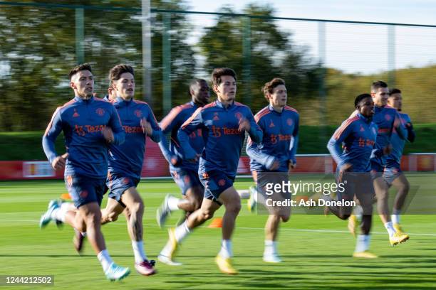 Lisandro Martinez of Manchester United and team-mates in action during a Manchester United training session at Carrington Training Ground on October...