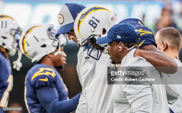Inglewood, CA, Sunday, October 23, 2022 - Los Angeles Chargers wide receiver Mike Williams is helped off the field after injuring his ankle against...