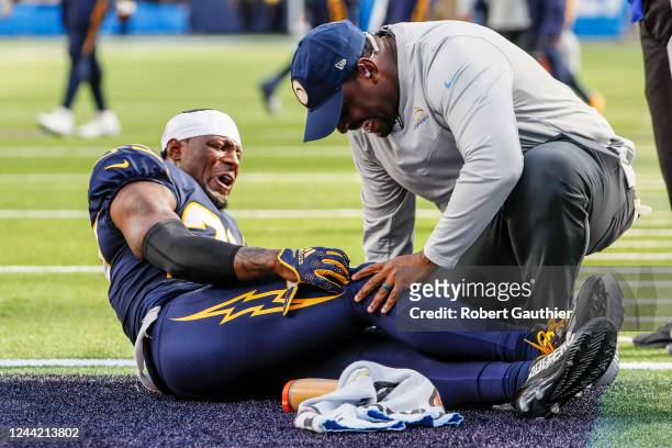 Inglewood, CA, Sunday, October 23, 2022 - Los Angeles Chargers cornerback J.C. Jackson writhes in pain after injuring his knee late in the game...