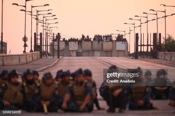 Security forces block the Republic Bridge with concrete barriers during a demonstration held at Tahrir Square marking the third anniversary of the...