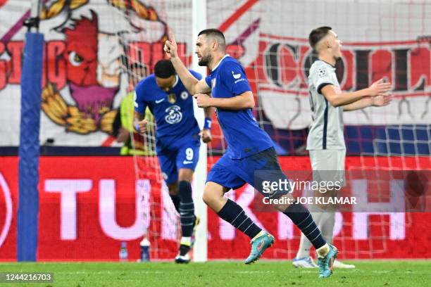 Chelsea's Croatian midfielder Mateo Kovacic celebrates scoring the team's first goal during the UEFA Champions League Group E football match between...
