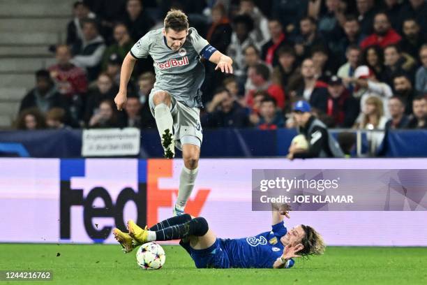 Salzburg's Austrian defender Maximilian Woeber jumps over Chelsea's English midfielder Conor Gallagher during the UEFA Champions League Group E...