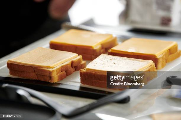 Grilled cheese sandwiches are prepared with Kraft Heinz NotCo American Style plant based cheese slices during a food tasting in New York, US, on...