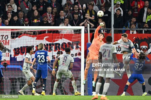 Chelsea's Spanish goalkeeper Kepa Arrizabalaga jumps to save the ball during the UEFA Champions League Group E football match between RB Salzburg and...