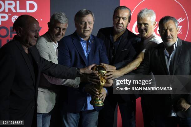 Argentina's 1978 and 1986 World Cup Champions Omar Larossa, Ricardo Giusti, Daniel Bertoni, Sergio Batista, Alberto Tarantini and Carlos Tapia pose...