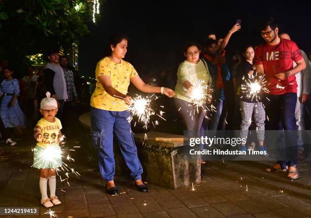 Mumbai Citizens celebrate Diwali with firecrackers at Marin drive on occasion of Laxmi Pujan, on October 24, 2022 in Mumbai, India. People decorated...