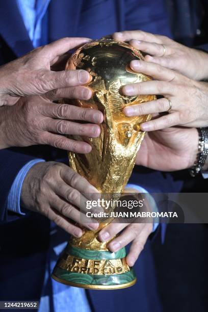 Argentina's 1978 and 1986 World Cup Champions Carlos Tapia, Sergio Batista, Daniel Bertoni, Alberto Tarantini, Omar Larrosa and Ricardo Giusti hold...