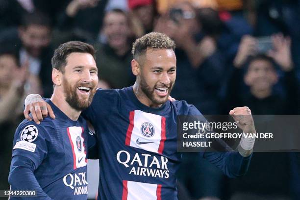 Paris Saint-Germain's Brazilian forward Neymar celebrates with Paris Saint-Germain's Argentine forward Lionel Messi after scoring his team's third...