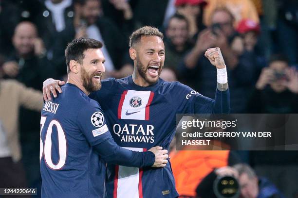 Paris Saint-Germain's Brazilian forward Neymar celebrates with Paris Saint-Germain's Argentine forward Lionel Messi after scoring his team's third...