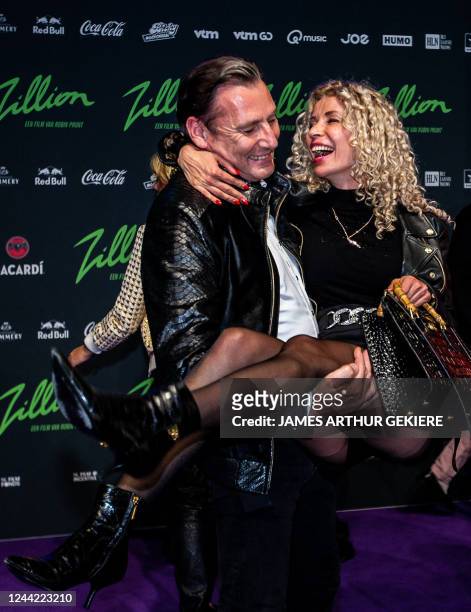 Belgian owner of the Euro-Art Harry Schurmans and public figure and sales manager at Euro-Art Olga Zelenko pose during the premiere of 'Zillion', a...