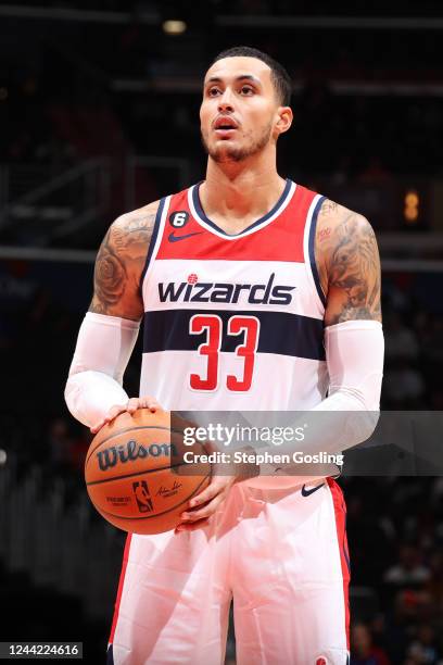 Kyle Kuzma of the Washington Wizards shoots a free throw during the game against the Detroit Pistons on October 25, 2022 at Capital One Arena in...
