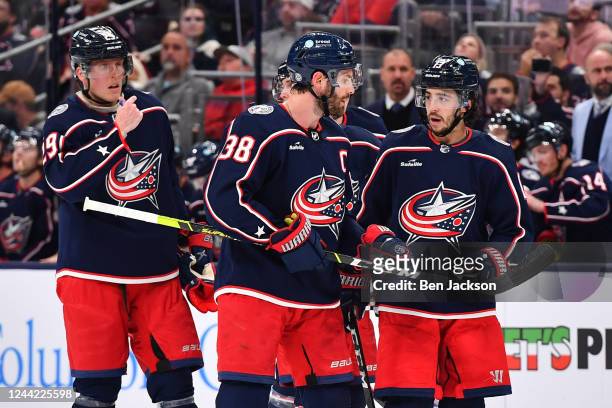 Boone Jenner of the Columbus Blue Jackets talks with Johnny Gaudreau of the Columbus Blue Jackets during the first period of a game against the...