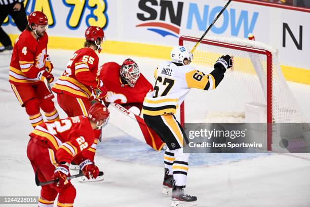 Pittsburgh Penguins Right Wing Rickard Rakell celebrates a goal by Pittsburgh Penguins Center Evgeni Malkin , not shown, during the second period of...