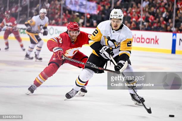 Calgary Flames Right Wing Blake Coleman chases down Pittsburgh Penguins Winger Sam Poulin during the third period of an NHL game between the Calgary...