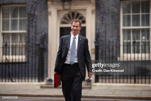 Jeremy Hunt, UK chancellor of the exchequer, leaves the first meeting of the Prime Minister's cabinet at number 10 in Downing Street on October 26,...