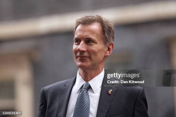 Jeremy Hunt, UK chancellor of the exchequer, leaves the first meeting of the Prime Minister's cabinet at number 10 in Downing Street on October 26,...