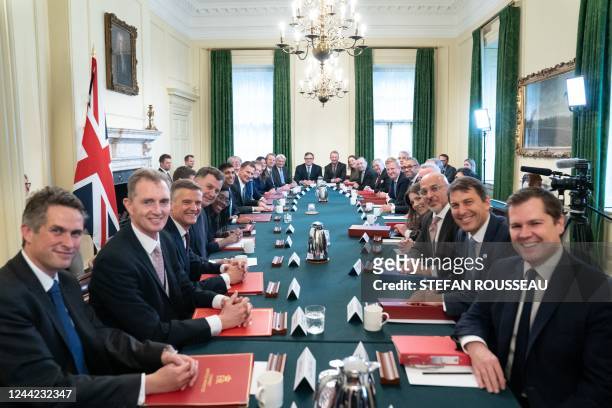 Britain's Prime Minister Rishi Sunak poses for a photograph alongside members of his new cabinet at his first cabinet meeting in 10 Downing Street in...