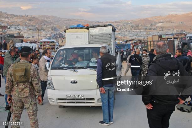 Syrians refugees prepare to leave Lebanon towards Syrian territory through the Wadi Hamid crossing in Arsal on October 26, 2022. - A first batch of...