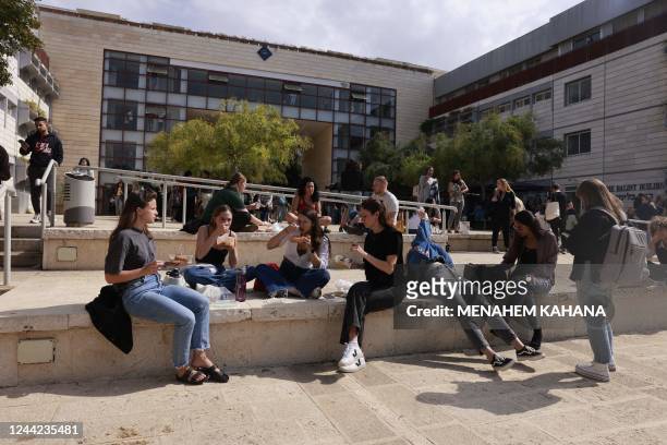 Students gather sit together at the Ariel university, in the central West Bank settlement of Ariel, on October 26, 2022.