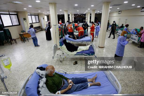 Medical staffers attend to patients being treated in an outbreak of Vibrio cholera at a ward in a mosque hall converted into a field hospital in the...