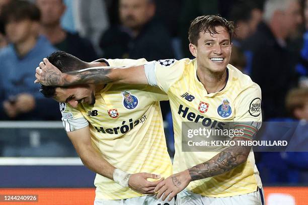 Porto's Canadian midfielder Stephen Eustaquio celebrates scoring his team's third goal with his teammates during the UEFA Champions League Group B...