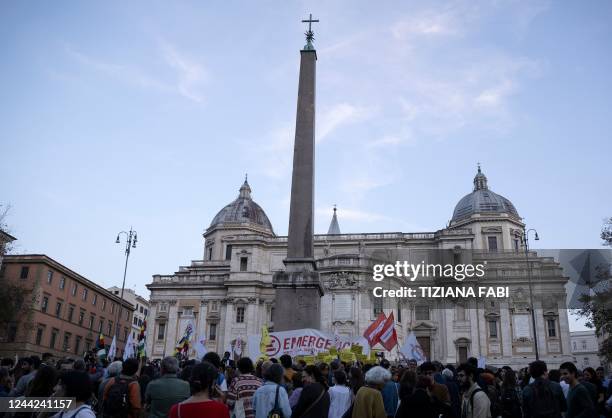 Protestors take part a demonstration against the Italy-Libya memorandum of understanding in Rome on October 26, 2022. - Humanitarian groups including...