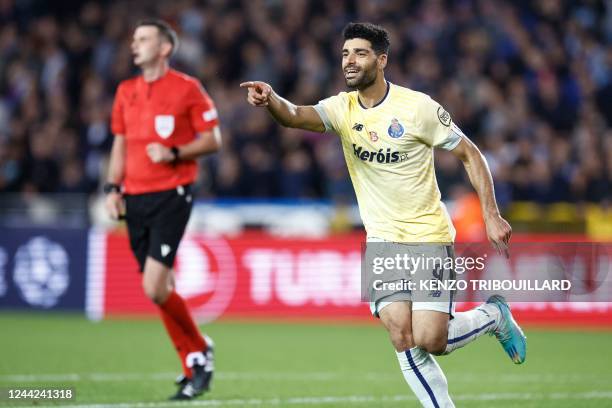 Porto's Iranian forward Mehdi Taremi celebrates scoring his team's fourth goal during the UEFA Champions League Group B second leg football match...