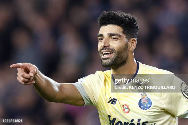 Porto's Iranian forward Mehdi Taremi celebrates scoring his team's fourth goal during the UEFA Champions League Group B second leg football match...