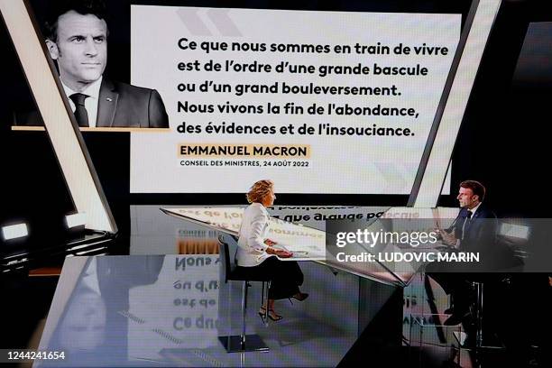 In this screen shot made in Paris on October 26, 2022 French president Emmanuel Macron speaks during an interview by French journalist and TV host...