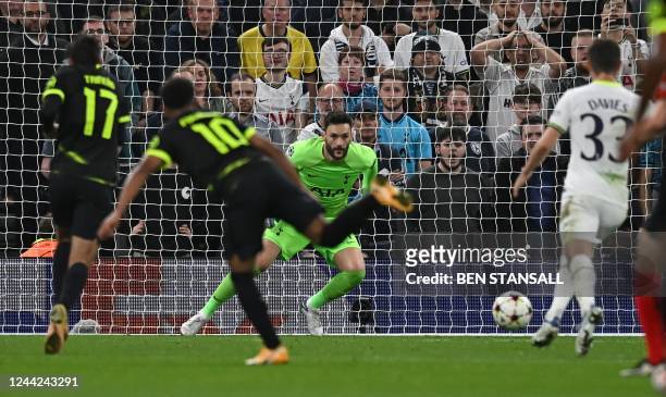 Tottenham Hotspur's French goalkeeper Hugo Lloris watches the ball before conceding the opening goal to Sporting Lisbon's English striker Marcus...