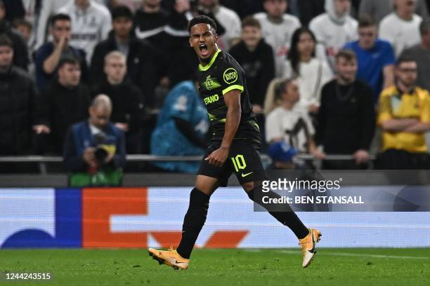 Sporting Lisbon's English striker Marcus Edwards celebrates scoring the opening goal during the UEFA Champions League group D football match between...