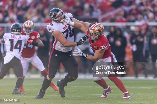 San Francisco 49ers defensive end Nick Bosa is blocked by Atlanta Falcons offensive tackle Kaleb McGary stands on the line during an NFL game against...