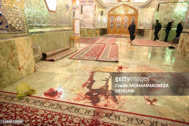 This picture shows blood stains following an armed attack at the Shah Cheragh mausoleum in the Iranian city of Shiraz on October 26, 2022. - At least...