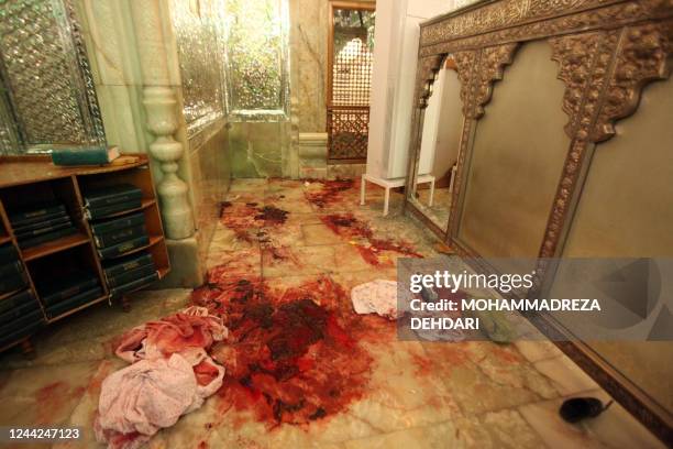 This picture shows blood stains following an armed attack at the Shah Cheragh mausoleum in the Iranian city of Shiraz on October 26, 2022. - At least...