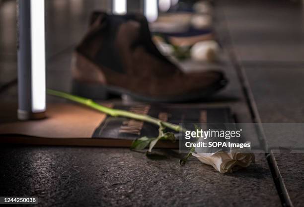 White rose and a shoe seen above the name of a homeless man who died in 2022. The social entity Fundación Arrels has called the Batecs de Llum event...