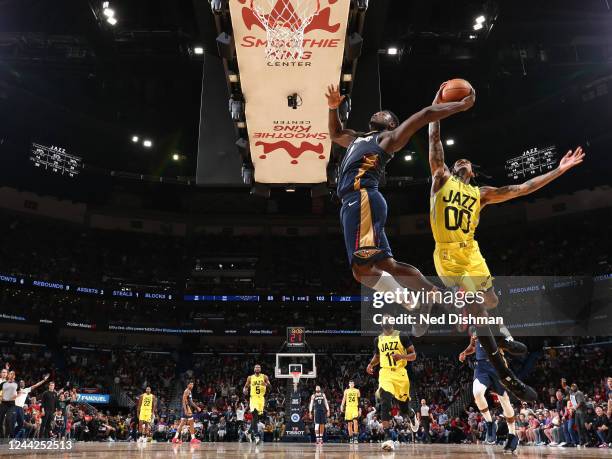 Zion Williamson of the New Orleans Pelicans attempts to dunks the ball against Jordan Clarkson of the Utah Jazz on October 23, 2022 at the Smoothie...