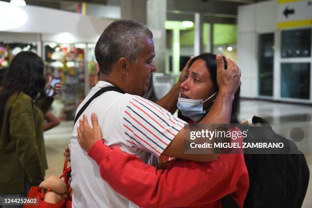 Venezuelan migrant is welcomed by a relative upon arrival from Panama after failing to cross to the US, at the Simon Bolivar International Airport in...