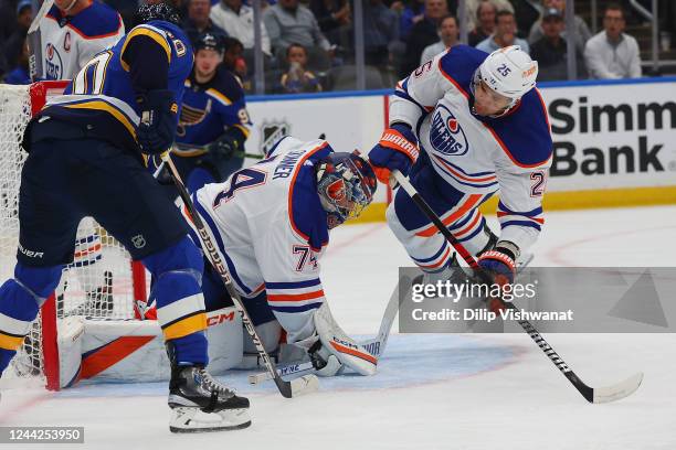 Stuart Skinner and Darnell Nurse of the Edmonton Oilers defend their goal net against the St. Louis Blues during the first period at Enterprise...