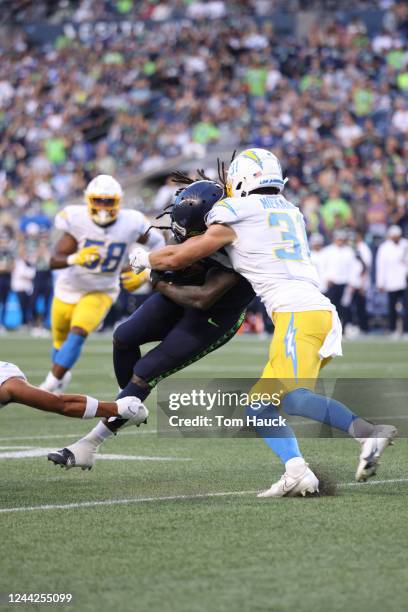 Seattle Seahawks running back Alex Collins runs with the ball during an NFL preseason football game between the Seattle Seahawks and the Los Angeles...