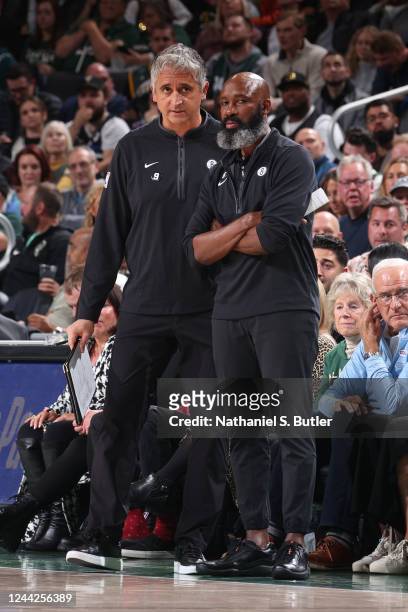 Jacque Vaughn and Igor Kokoskov of the Brooklyn Nets coach against the Milwaukee Bucks on October 26, 2022 at the Fiserv Forum in Milwaukee,...
