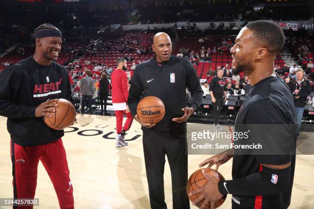 Jimmy Butler of the Miami Heat and Damian Lillard of the Portland Trail Blazers smile before the game on October 26, 2022 at the Moda Center Arena in...