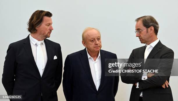 German celebrity chef Alfons Schuhbeck and his lawyers Sascha Koenig and Markus Gotzens wait on October 27, 2022 in a courtroom of the Palace of...